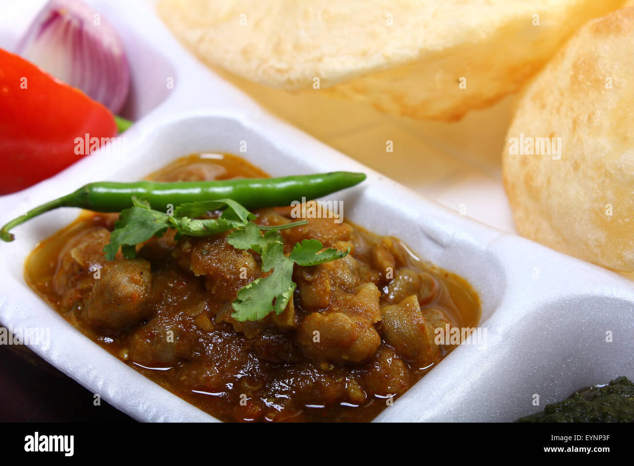 spicy chole bhature, with green chili topping indian dish Stock Photo