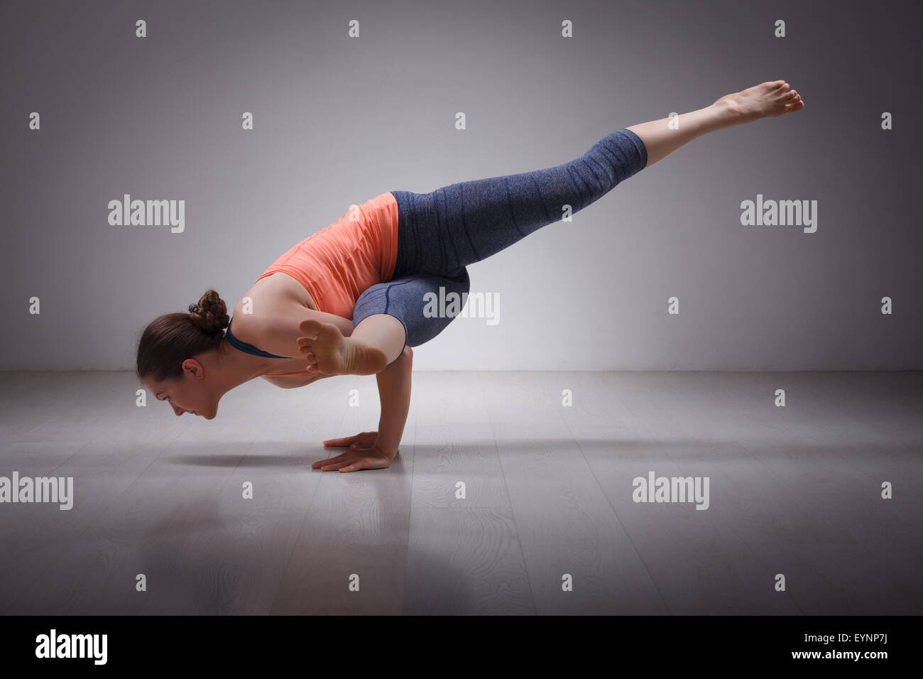 Beautiful sporty fit yogi girl practices yoga asana eka pada kou Stock Photo