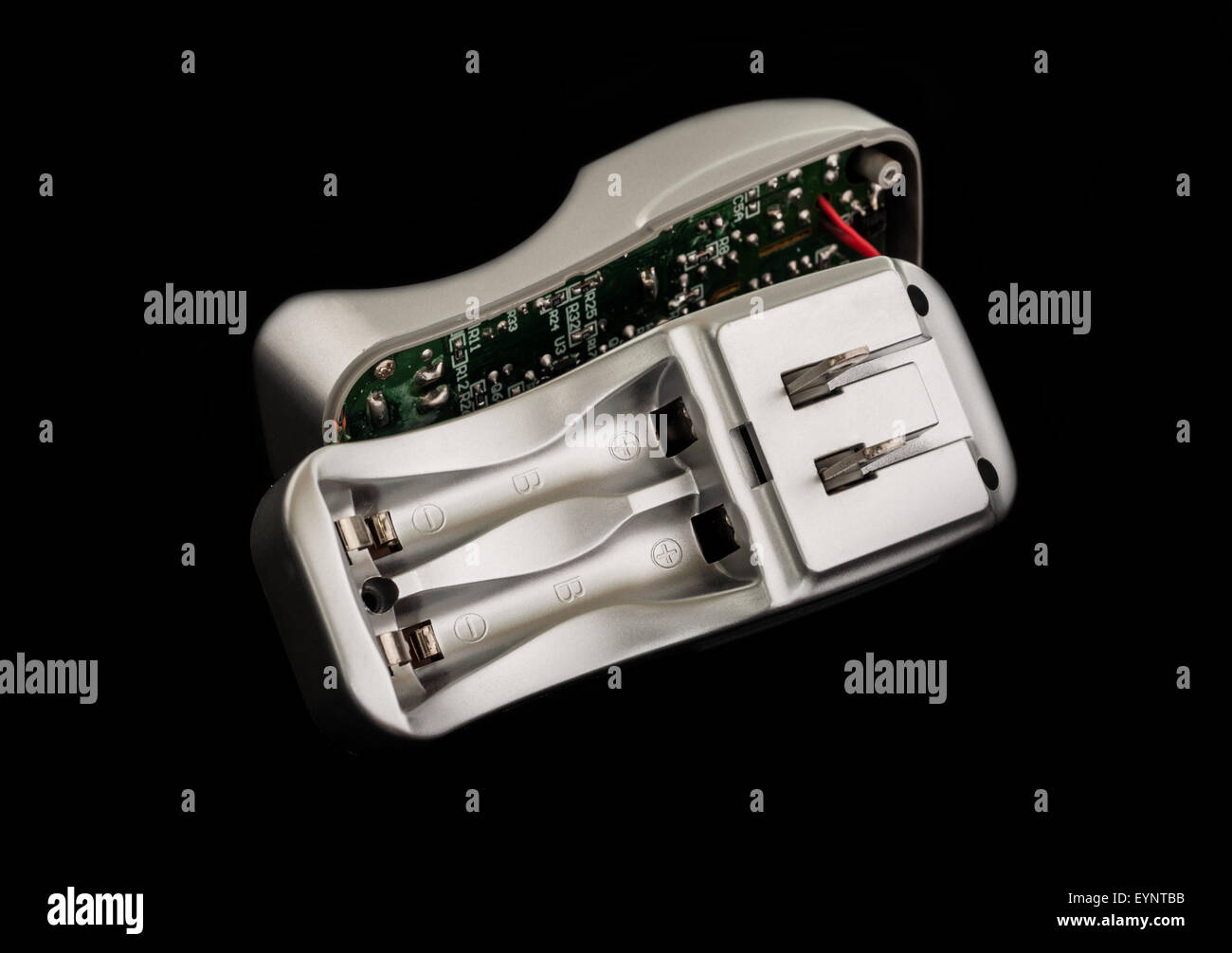 Battery charger broken, Isolated on black background Stock Photo