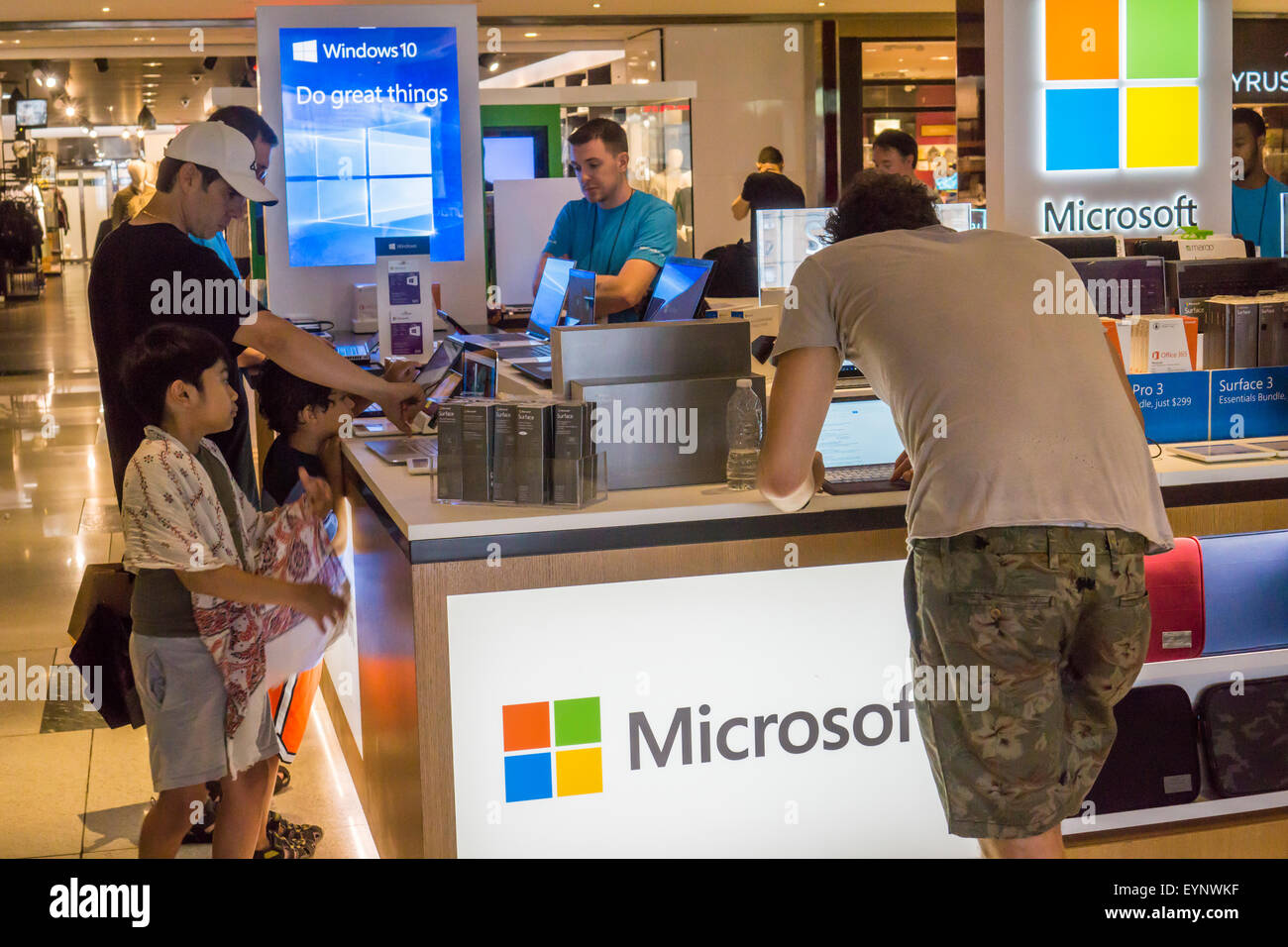 Customers try out computers at a Microsoft kiosk in the Time Warner Center in New York promoting Windows 10 and other products, seen on Thursday, July 30, 2015. Windows 10 was released as a free upgrade with minimal hoopla yesterday. (© Richard B. Levine) Stock Photo