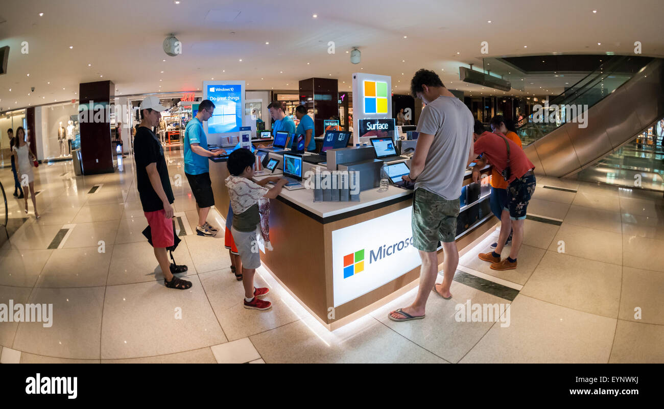 Customers try out computers at a Microsoft kiosk in the Time Warner Center in New York promoting Windows 10 and other products, seen on Thursday, July 30, 2015. Windows 10 was released as a free upgrade with minimal hoopla yesterday. (© Richard B. Levine) Stock Photo