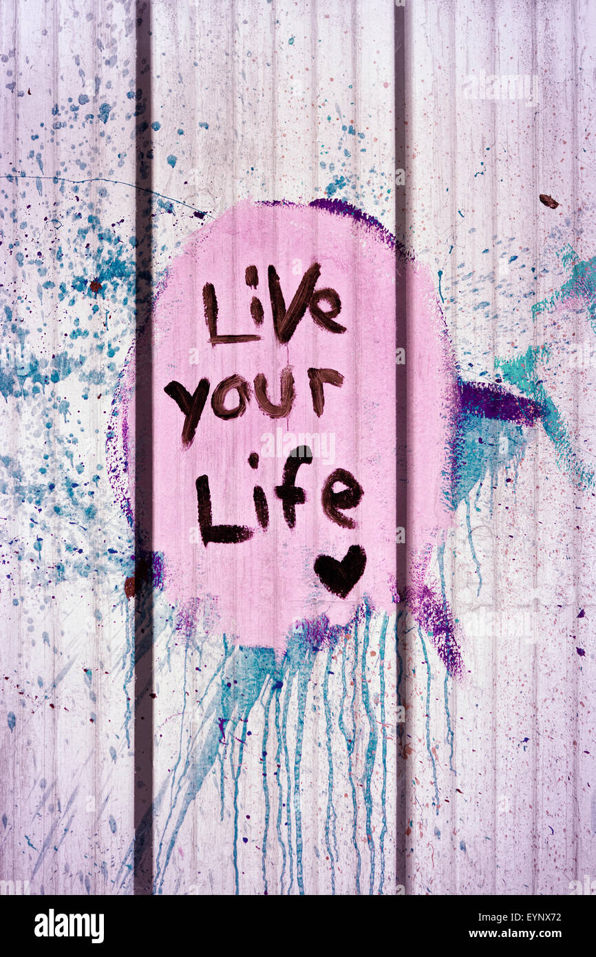 live your life tag style on wall Stock Photo