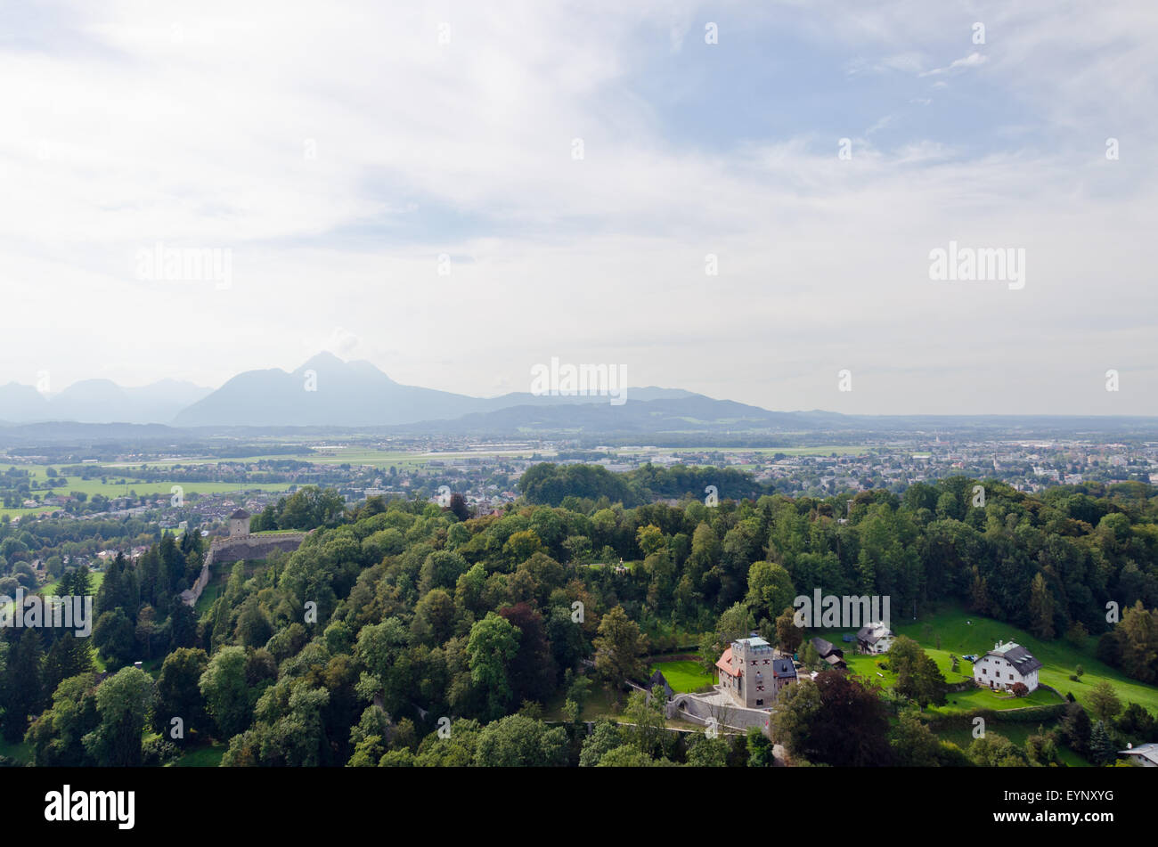 Houses in Alps landscape on green grass lawn Stock Photo - Alamy