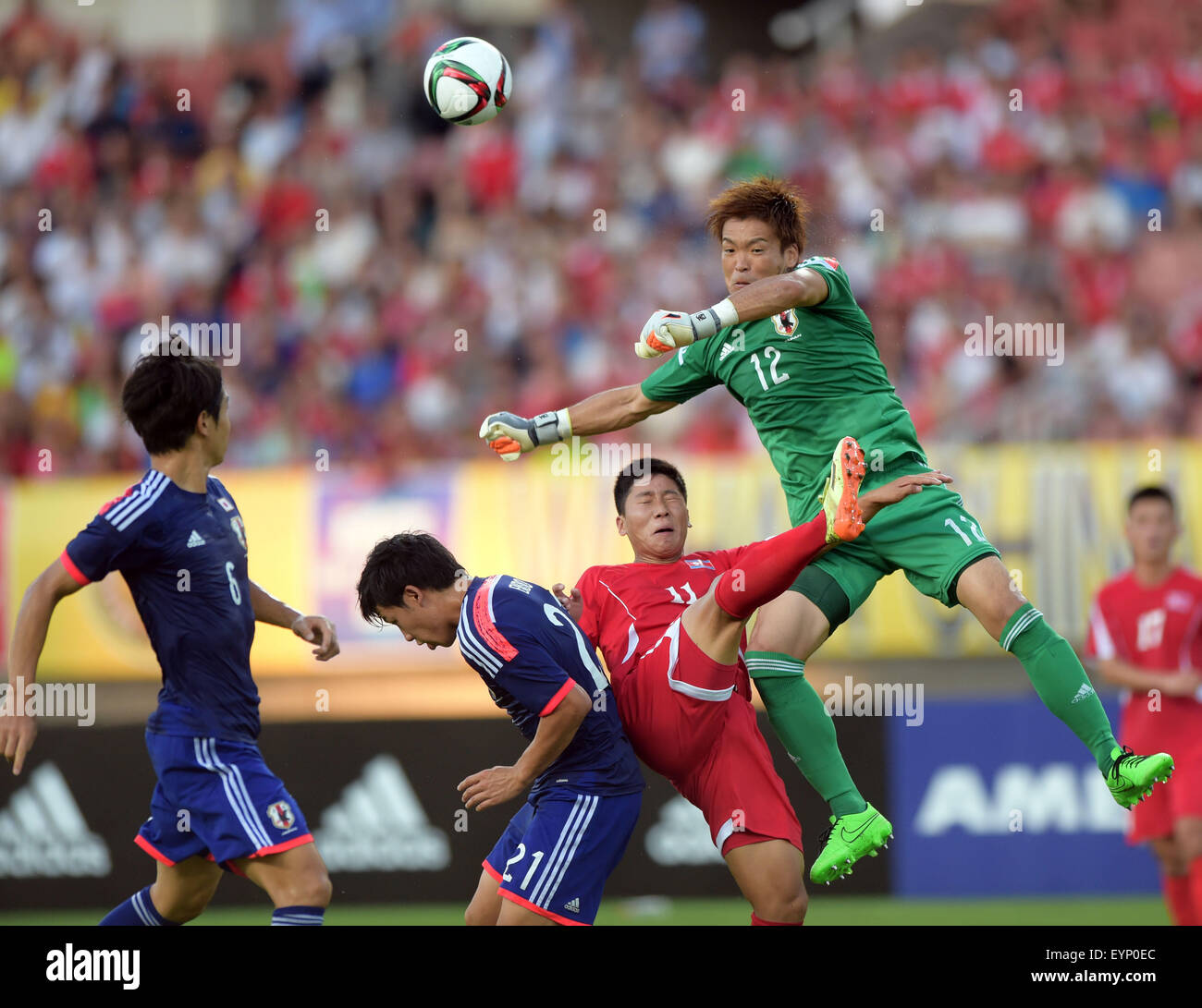 Wuhan, China's Hubei Province. 2nd Aug, 2015. Japan's goalkeeper Nishikawa Shusaku (Top) vies with Jong Il Gwan (2nd R) of the Democratic People's Republic of Korea (DPRK) during their match at the 2015 EAFF(East Asian Football Federation) East Asian Cup in Wuhan, capital of central China's Hubei Province, Aug. 2, 2015. DPRK won 2-1. © Cheng Min/Xinhua/Alamy Live News Stock Photo