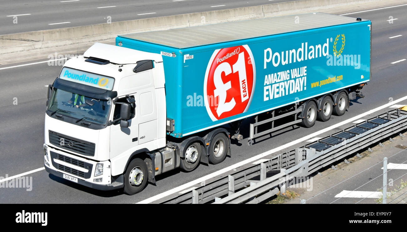 Supply chain logistics for retail stores business Poundland articulated trailer with advert & Volvo hgv juggernaut truck lorry on English UK motorway Stock Photo