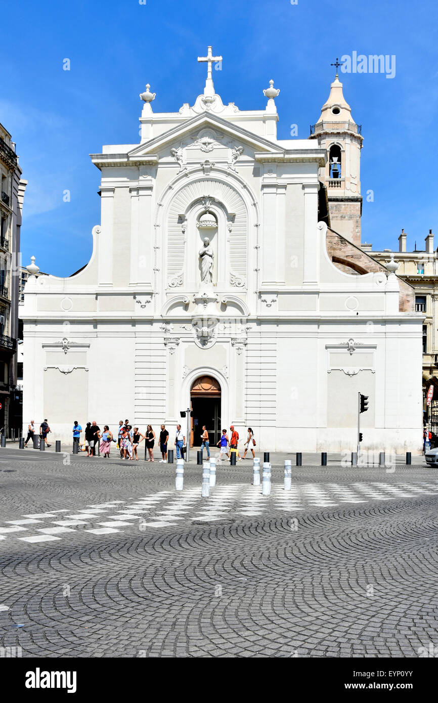 Marseille Vieux-Port France cobbled street & white façade of Catholic church of Église Saint-Ferréol les Augustins in French Old Port Stock Photo