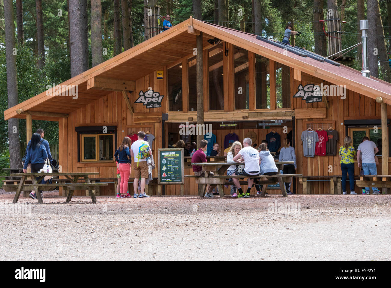 people sitting on benches outside Go Ape activity centre cannock chase Staffordshire West Midlands UK Stock Photo