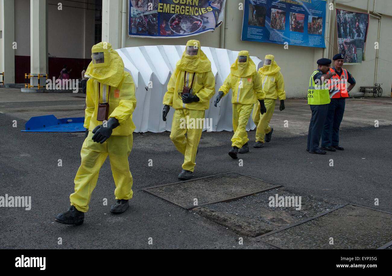 Kolkata, Indian state West Bengal. 2nd Aug, 2015. Indian security personnel take part in a drill on chemical, biological, radiological and nuclear emergency at cargo terminal of Netaji Subhas Chandra Bose International Airport in Kolkata, capital of eastern Indian state West Bengal, Aug. 2, 2015. National Disaster Response Force (NDRF), Airports Authority of India (AAI) and other disaster management group took part in this exercise. Credit:  Tumpa Mondal/Xinhua/Alamy Live News Stock Photo