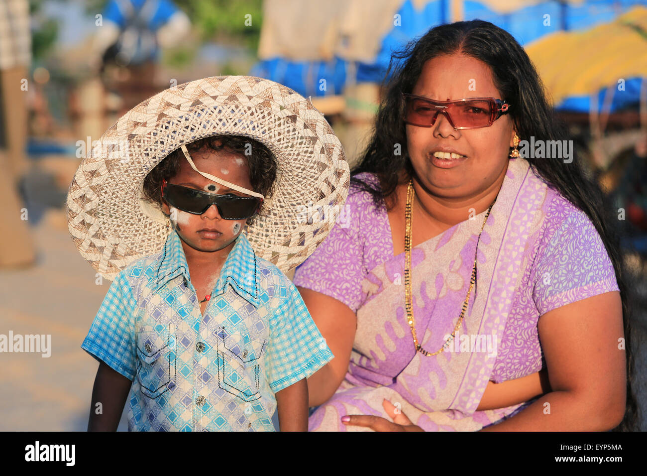 Editorial: Indian mother with her lovely son with big hat in Hampi, Hampi, 3 March 2013, India. Stock Photo