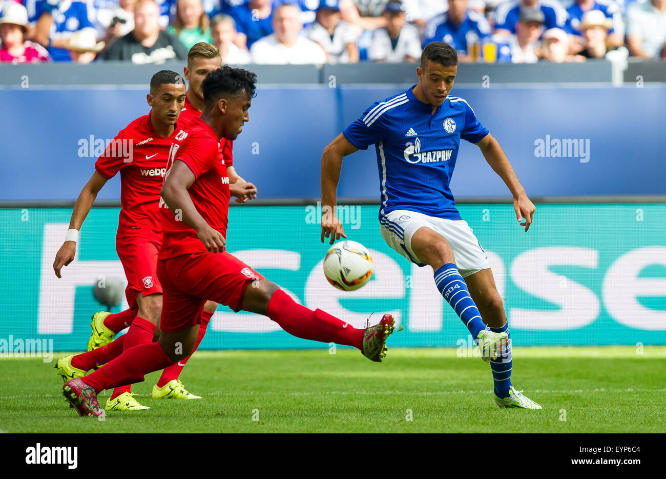 Gelsenkirchen, Germany. 02nd Aug, 2015. Schalke's Franco Di Santo (R) and Enschede's Renato Tapia vie for the ball during a soccer friendly match between FC Schalke 04 and FC Twente Enschede at Veltins Arena in Gelsenkirchen, Germany, 02 August 2015. Photo: GUIDO KIRCHNER/dpa/Alamy Live News Stock Photo