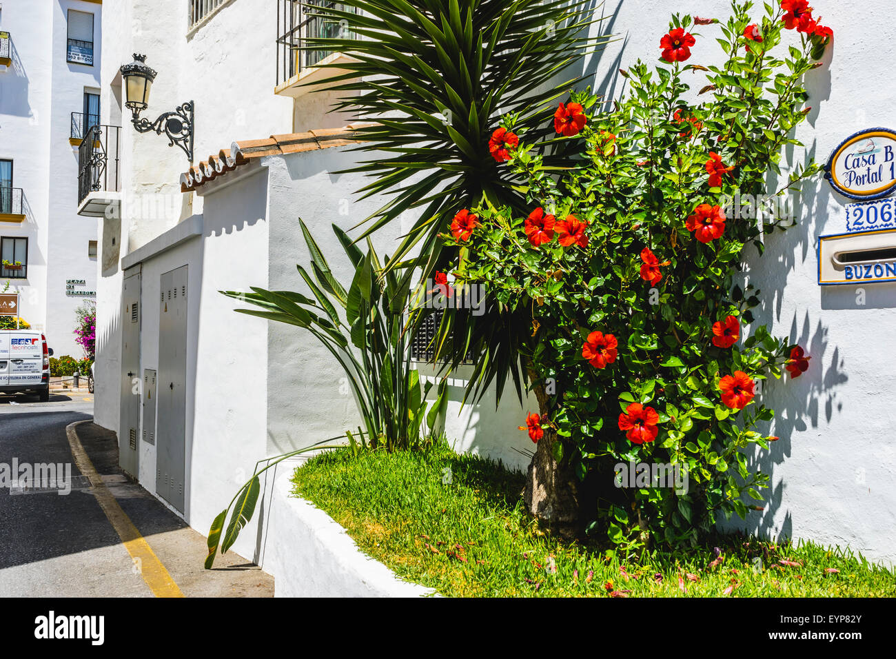 streets of Marbella in Spain with flowers and plants on the facade ...