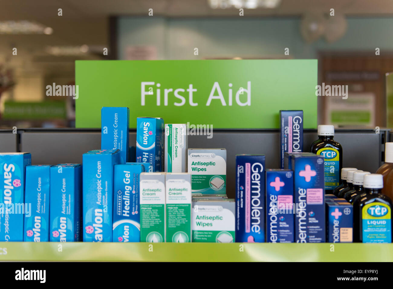 First aid treatment at a chemist store Stock Photo Alamy