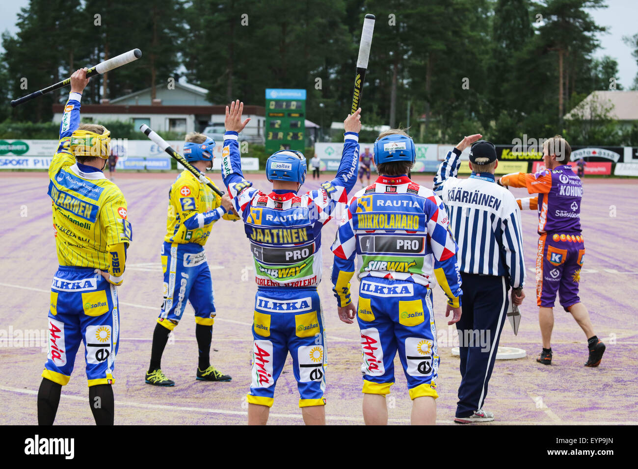 Sotkamo, Finland, 2nd August 2015. Action from a Superpesis League match between Sotkamo (Sotkamon Jymy in purple and orange) and Alajärvi (Alajärven Ankkurit in blue and yellow). Sotkamo have won the last four league titles in Pesis (Pesäpallo) – a form of baseball that is the Finnish national summer sport. Sotkamo also won this match 2-0. Credit: Rob Watkins/Alamy Live News Team Stock Photo