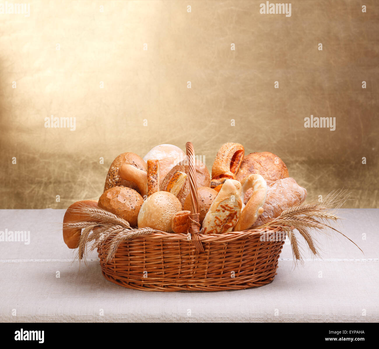 Lots of assorted bakery products in basket, big copy space on top Stock