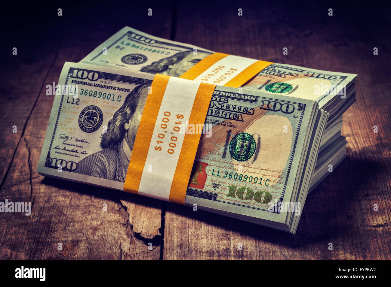 Stacks of new 100 US dollars 2013 banknotes Stock Photo