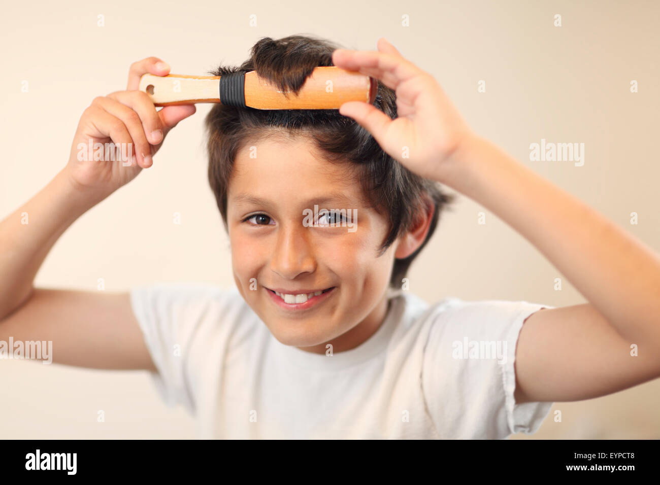 Teen boy brushing hair hires stock photography and images Alamy