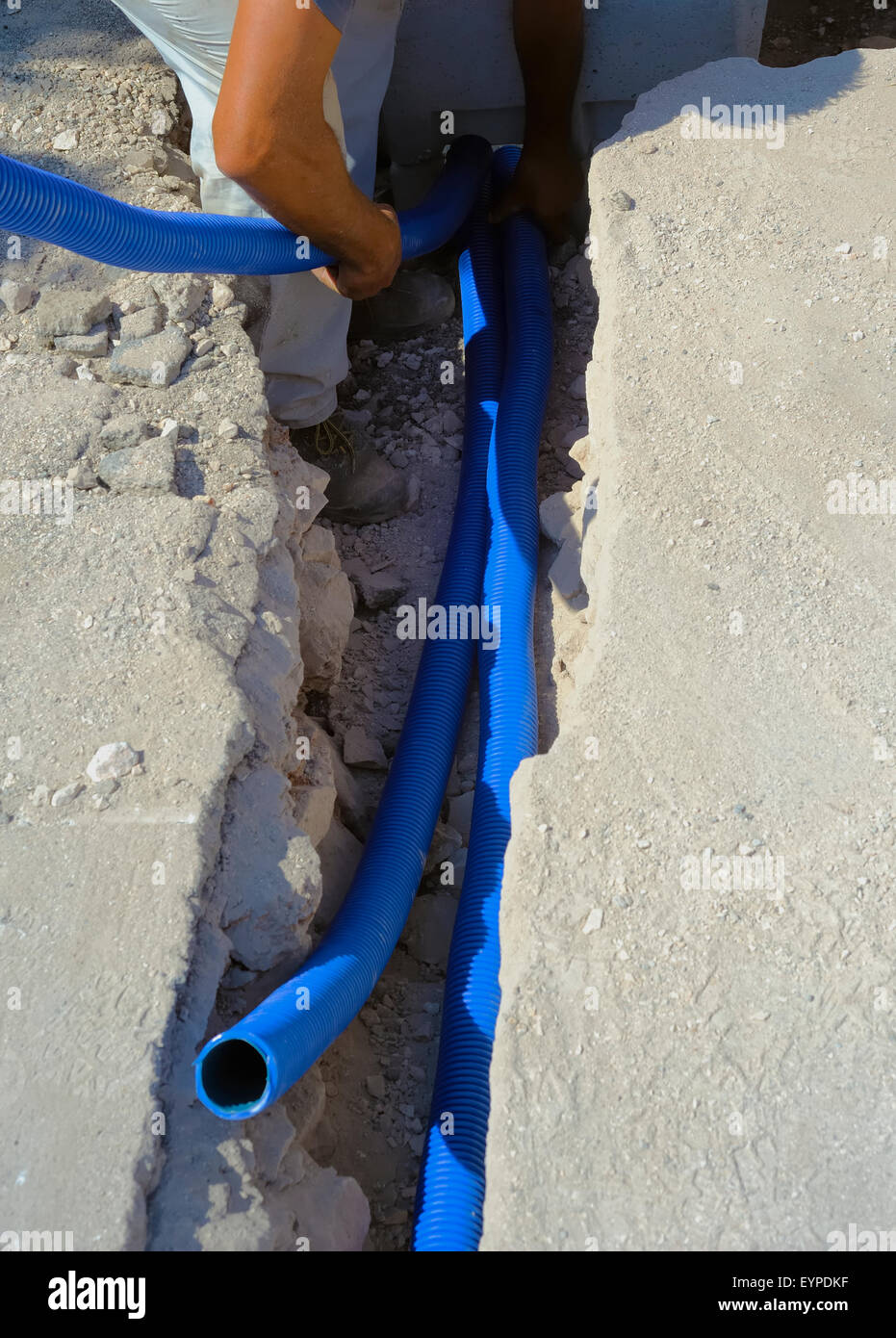 fiber optic cables buried in a micro trench by a worker Stock Photo Alamy