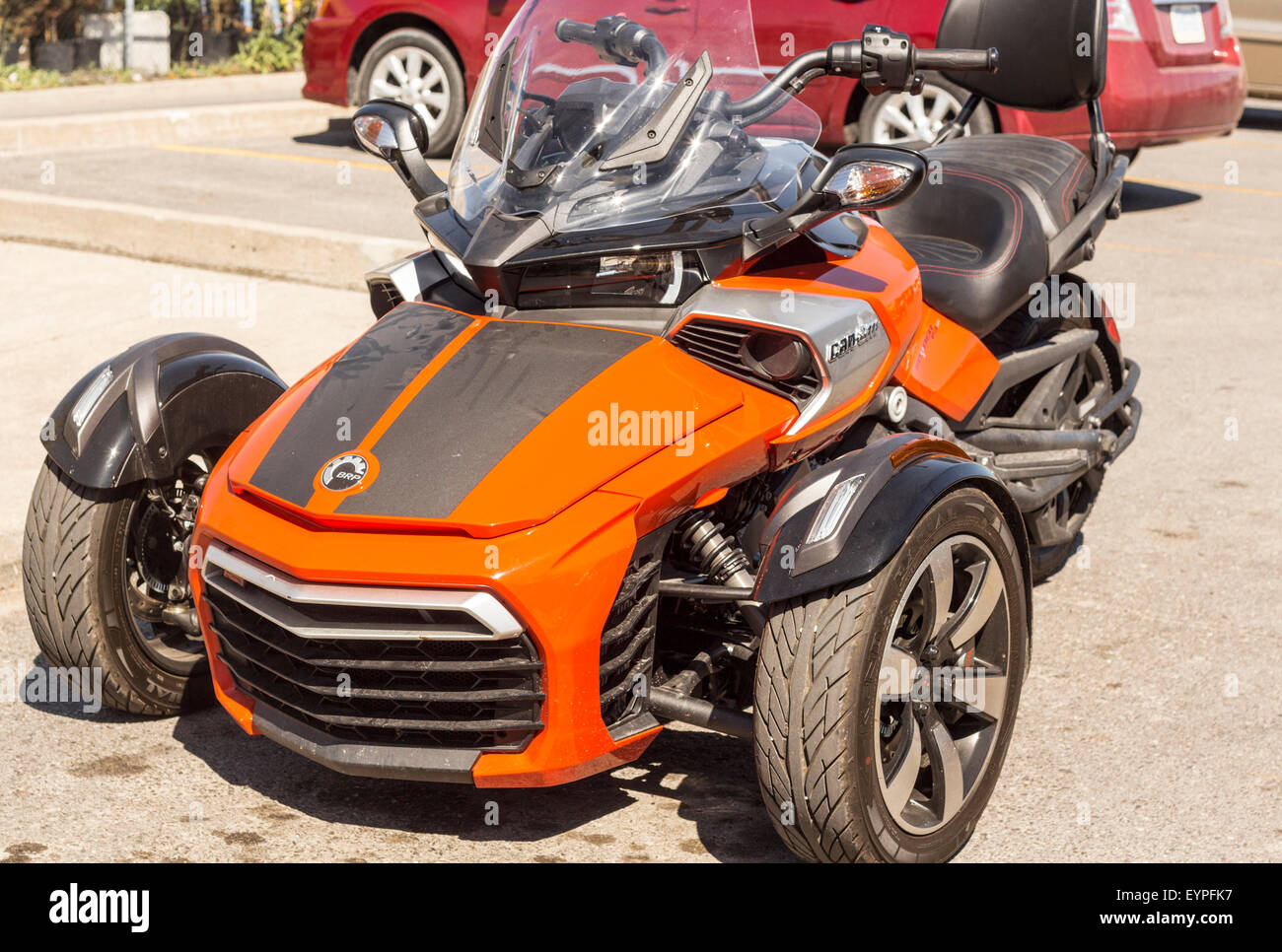 Orange BRP Can-Am Spyder FS Three Wheeler Motorcycle front three quarter view Stock Photo