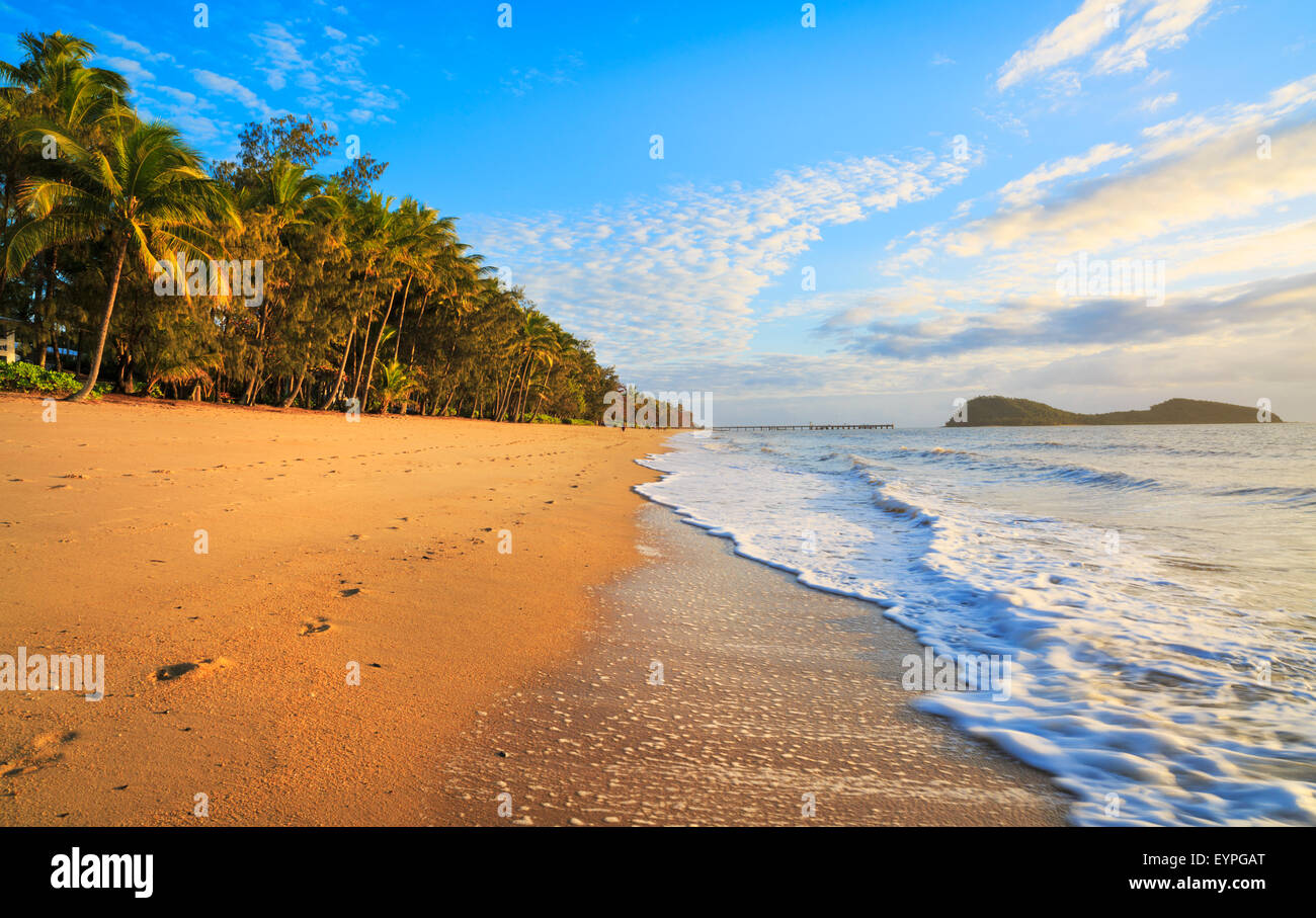 Palm Cove beach at sunrise with Double Island in the distance. Cairns