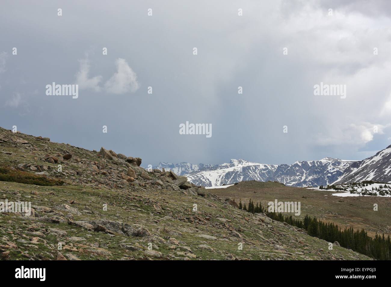 Rain clouds over the mountains at Rocky Mountain National Park Stock Photo