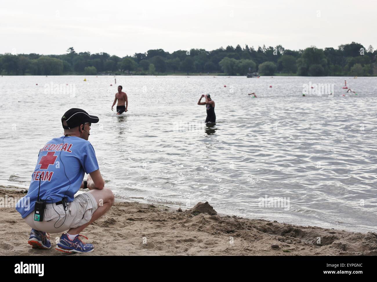A member of the medical team watches swimmers at the Lifetime Fitness triathlon in Minneapolis. Stock Photo