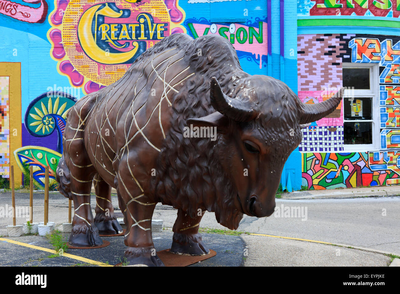 Fiberglass buffalo in front a of a decorated art gallery. Stock Photo