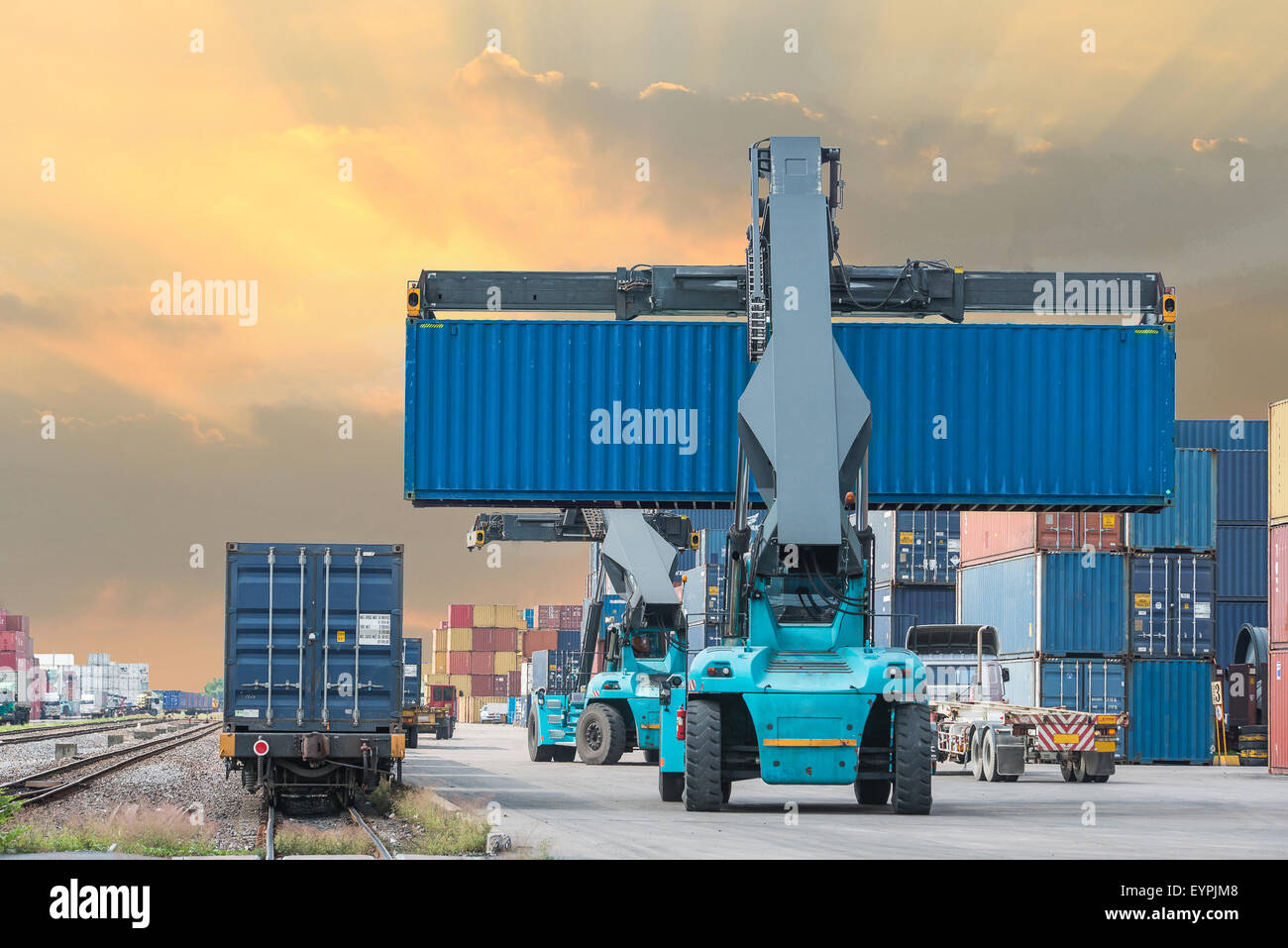 forklift handling container box loading to freight train Stock Photo ...