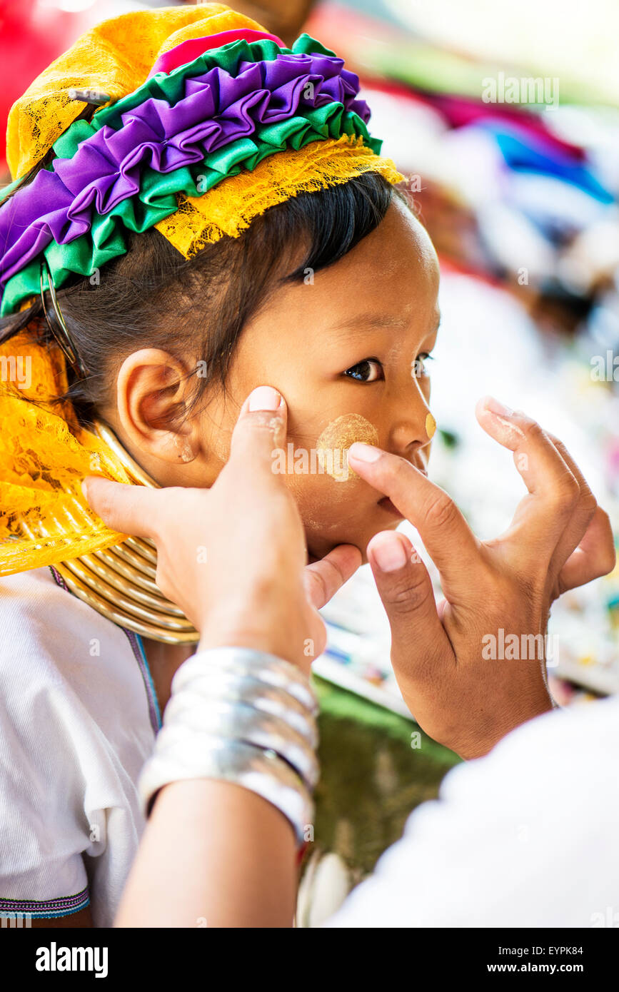 Young Kayan girl gets make up apllied in Chiang Mai, Thailand, Asia. Stock Photo