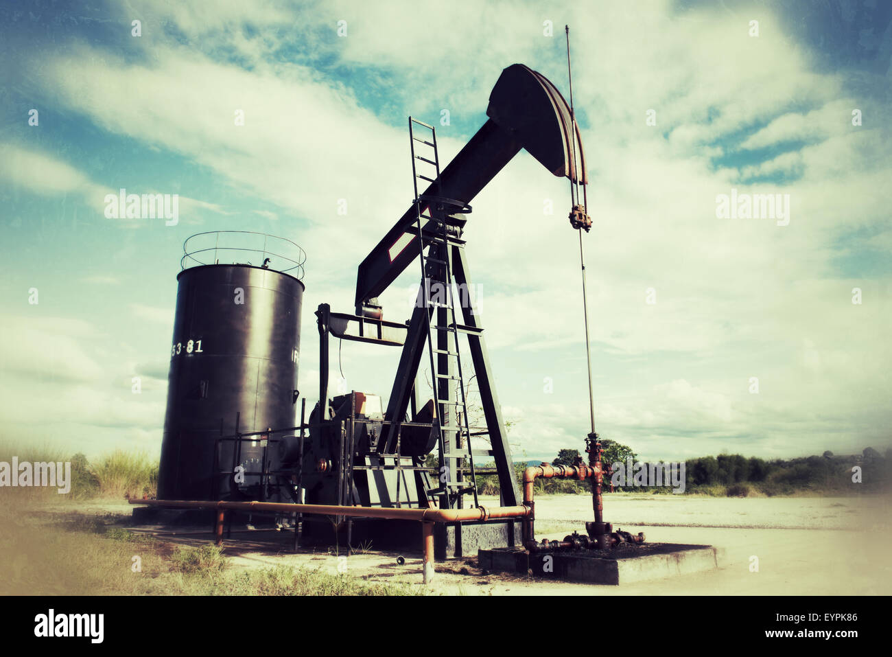 pumpjack pumping crude oil from oil well vintage style Stock Photo