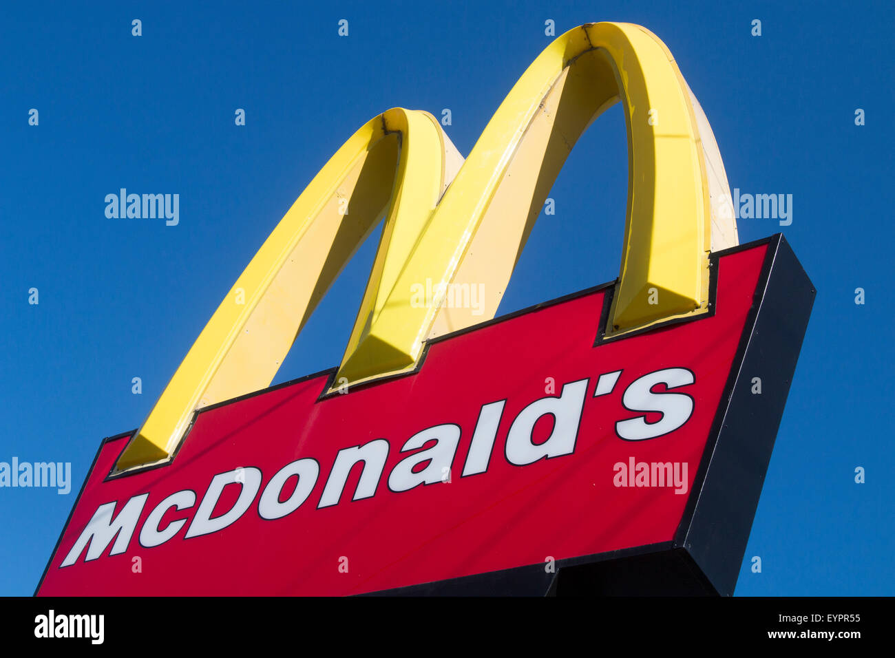 Mcdonalds famous sign and logo against a deep blue winter sky in Sydney,australia Stock Photo