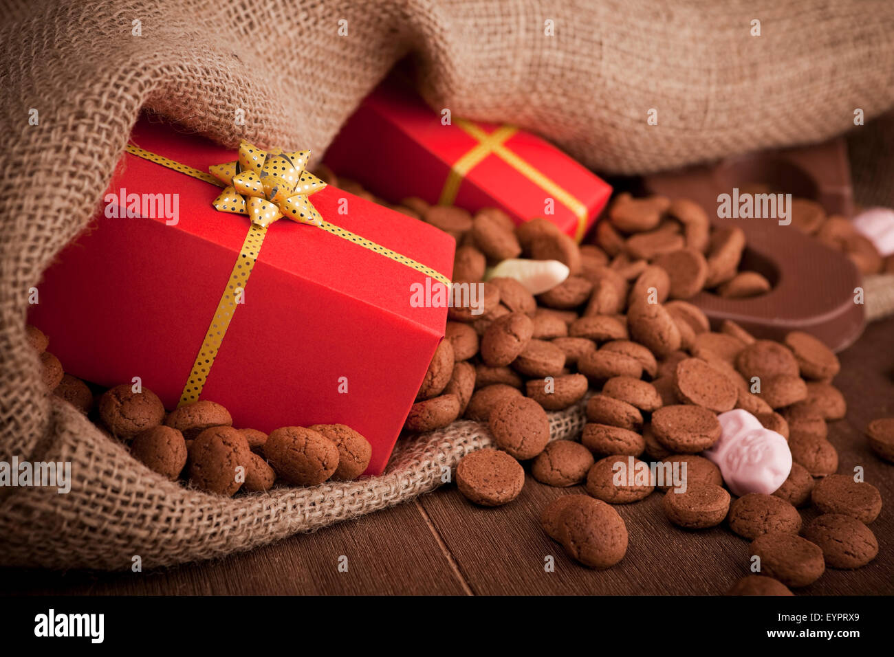 'De zak van Sinterklaas' (St. Nicholas' bag) filled with 'pepernoten', a letter of chocolate and sweets. A Dutch tradition. Stock Photo