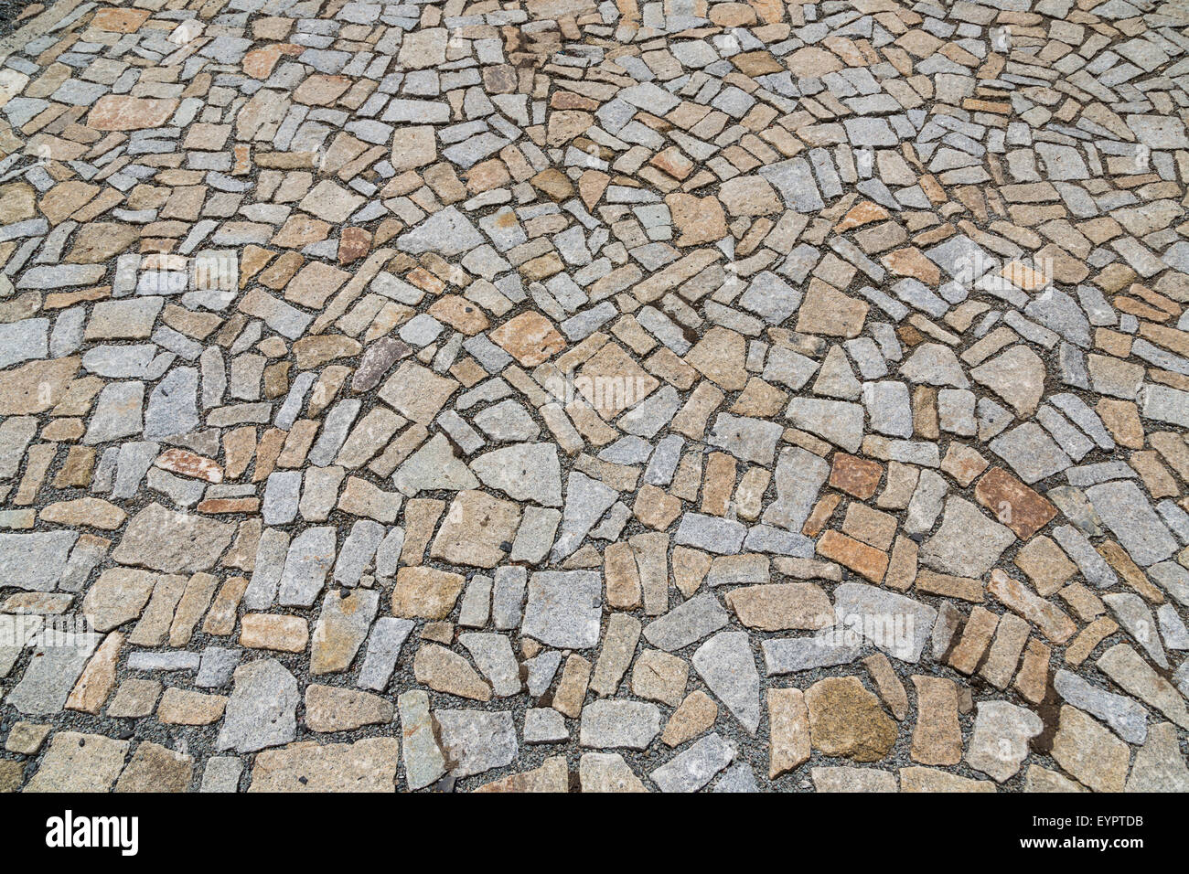 The stone pavement as the background texture, Stone block road pavement Stock Photo