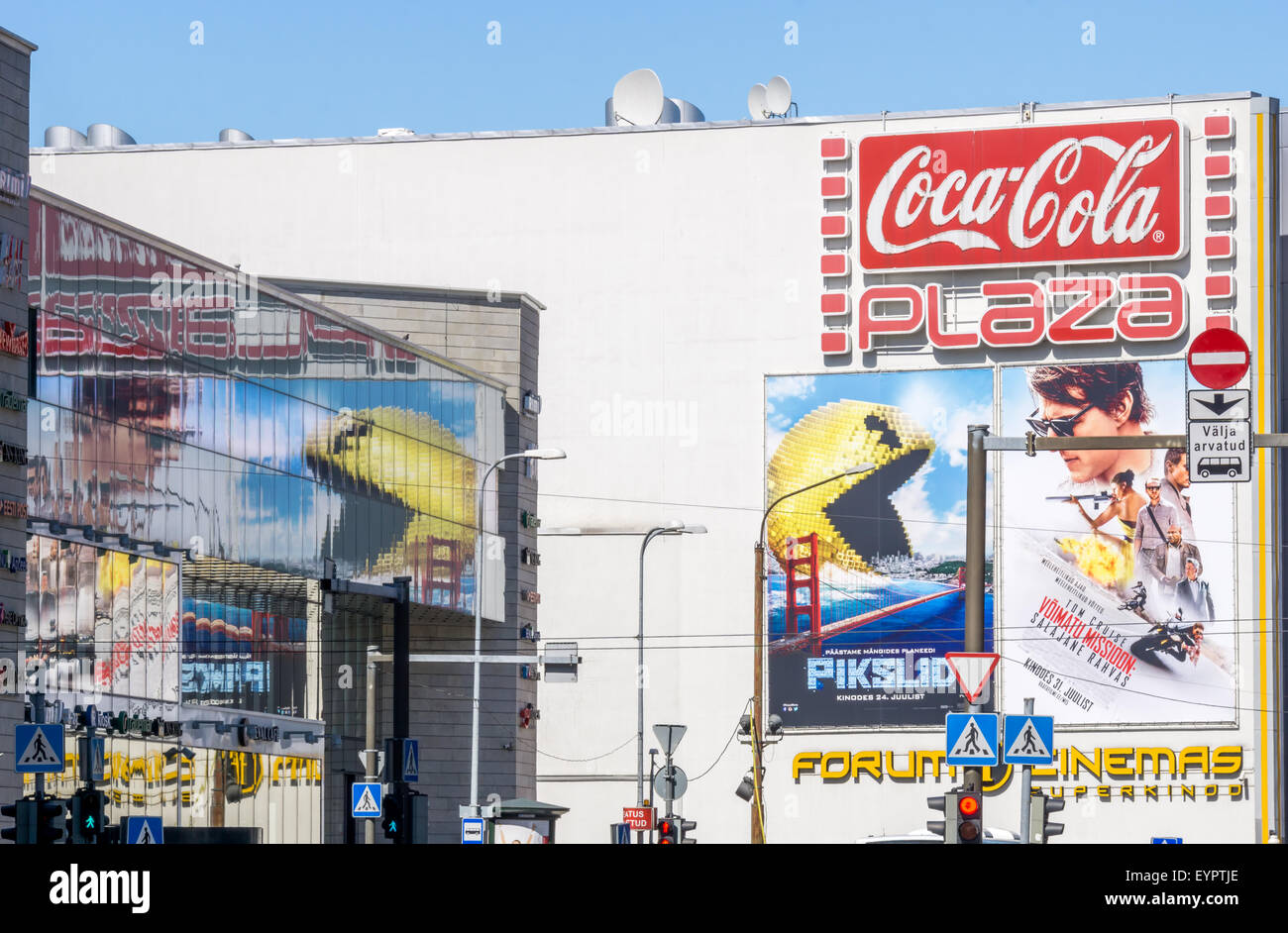 Tallinn, Estonia. 1st Aug, 2015. Pixels and Mission Impossible - Rogue Nation movies billboards on the Coca-Cola Plaza cinema in Tallinn. Pac-Man and Tom Cruise, Jeremy Renner, Simon Pegg, Rebecca Ferguson, Ving Rhames and Alec Baldwin are seen in the billboards. Credit:  Sergey Hmelevskih/Alamy Live News Stock Photo