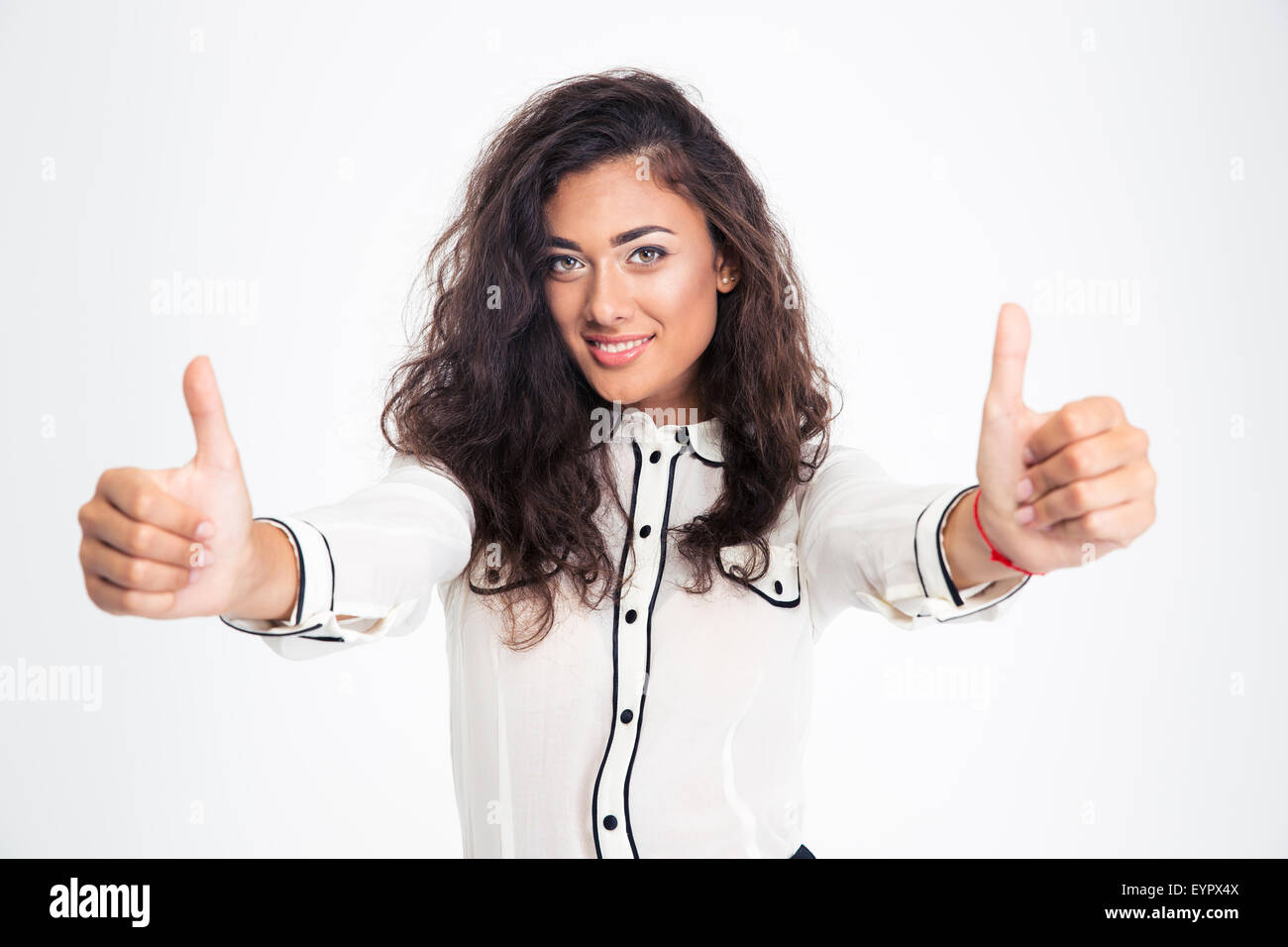 Happy businesswoman showing thumbs up isolated on a white background ...