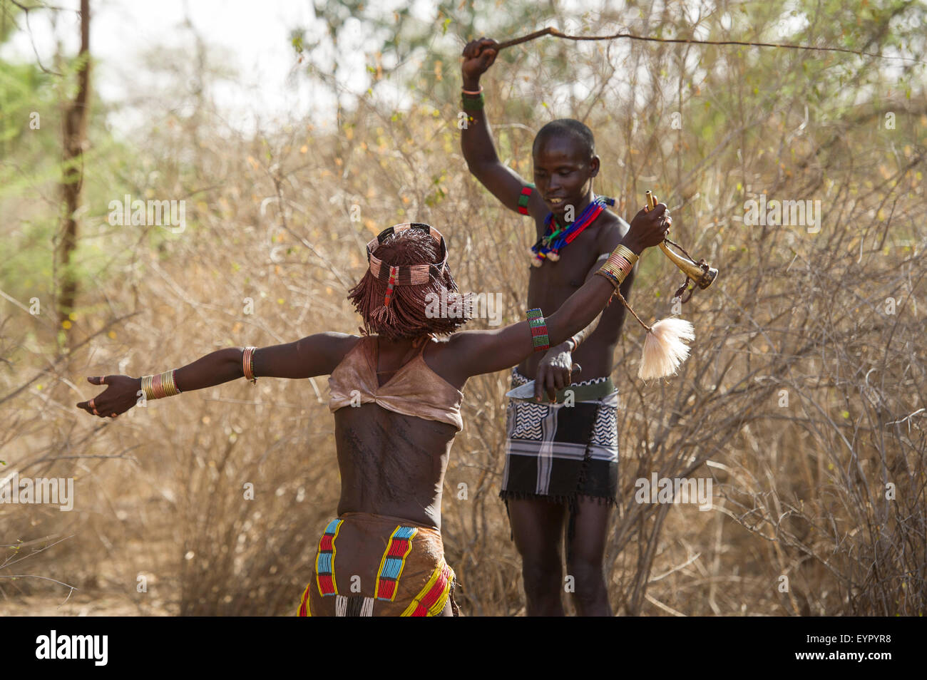 Woman whipping man hi-res stock photography and images