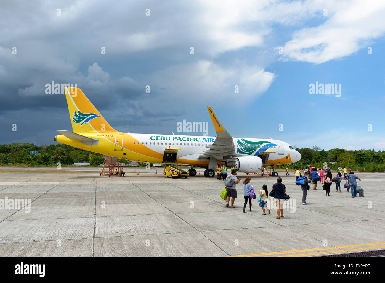 Bohol, Philippines - Jun 1, 2015: Tourists  getting on of a Cebu Pacific Air plane on Tagbilaran Airport on Bohol island, Philip Stock Photo