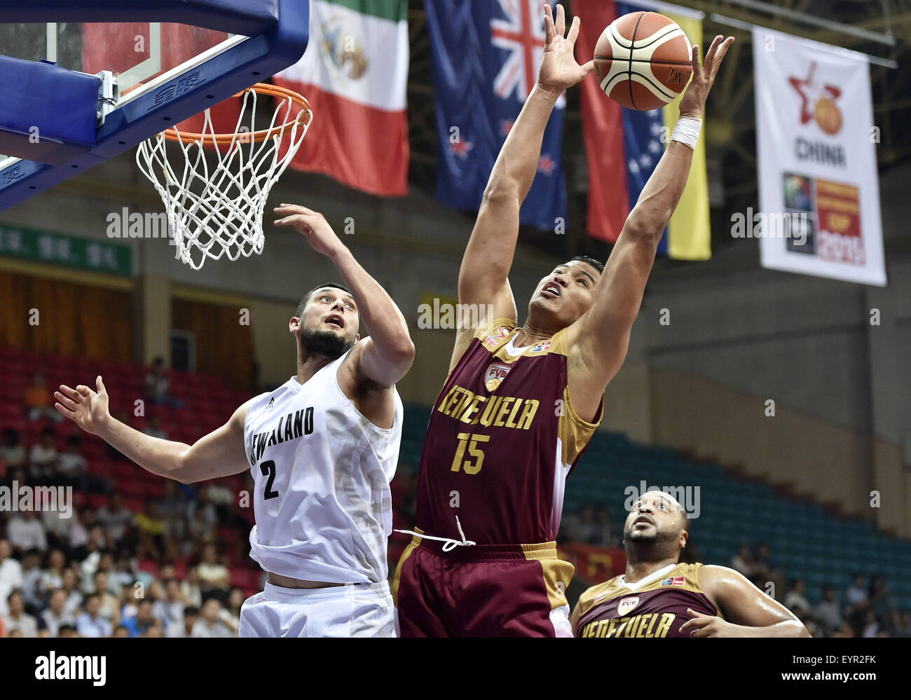 Qingyuan, China's Guangdong Province. 3rd Aug, 2015. Windi Graterol (R) of Venezuela competes during the match against New Zealand at Stankovic Continental Cup 2015 in Qingyuan, south China's Guangdong Province, Aug. 3, 2015. New Zeanland won 72-65. Credit:  Liang Xu/Xinhua/Alamy Live News Stock Photo