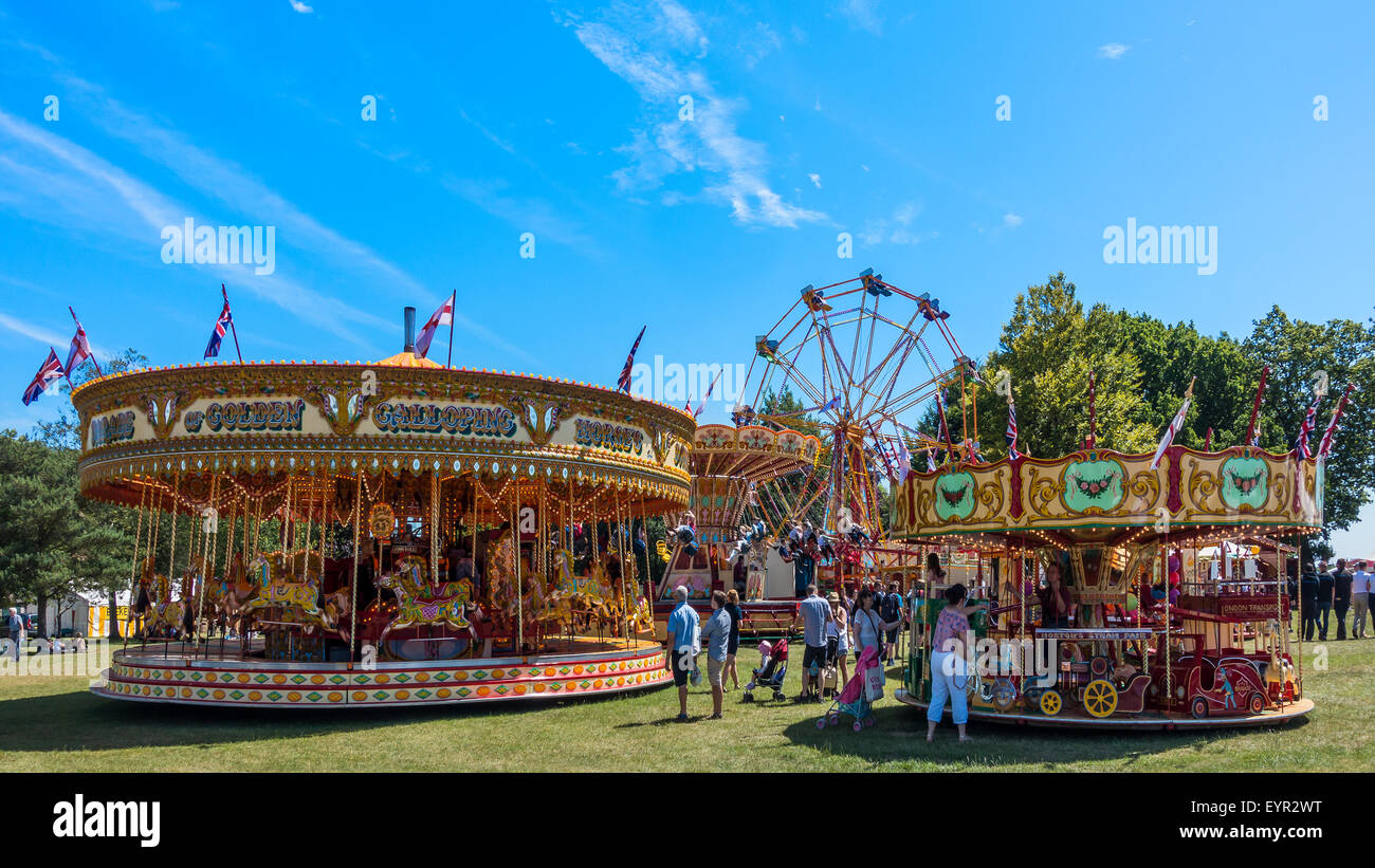 Vintage Funfair Fairground Carousel Galloping Horses Merry go Round Big Wheel Chairoplane Stock Photo