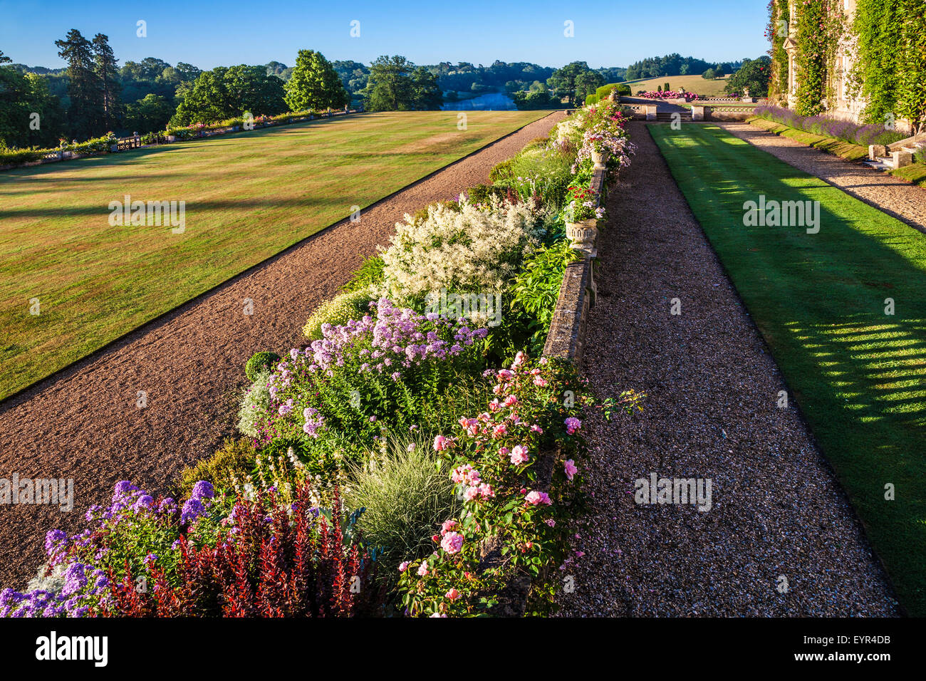 Herbaceous border and parkland below the terrace of Bowood House in Wiltshire. Stock Photo