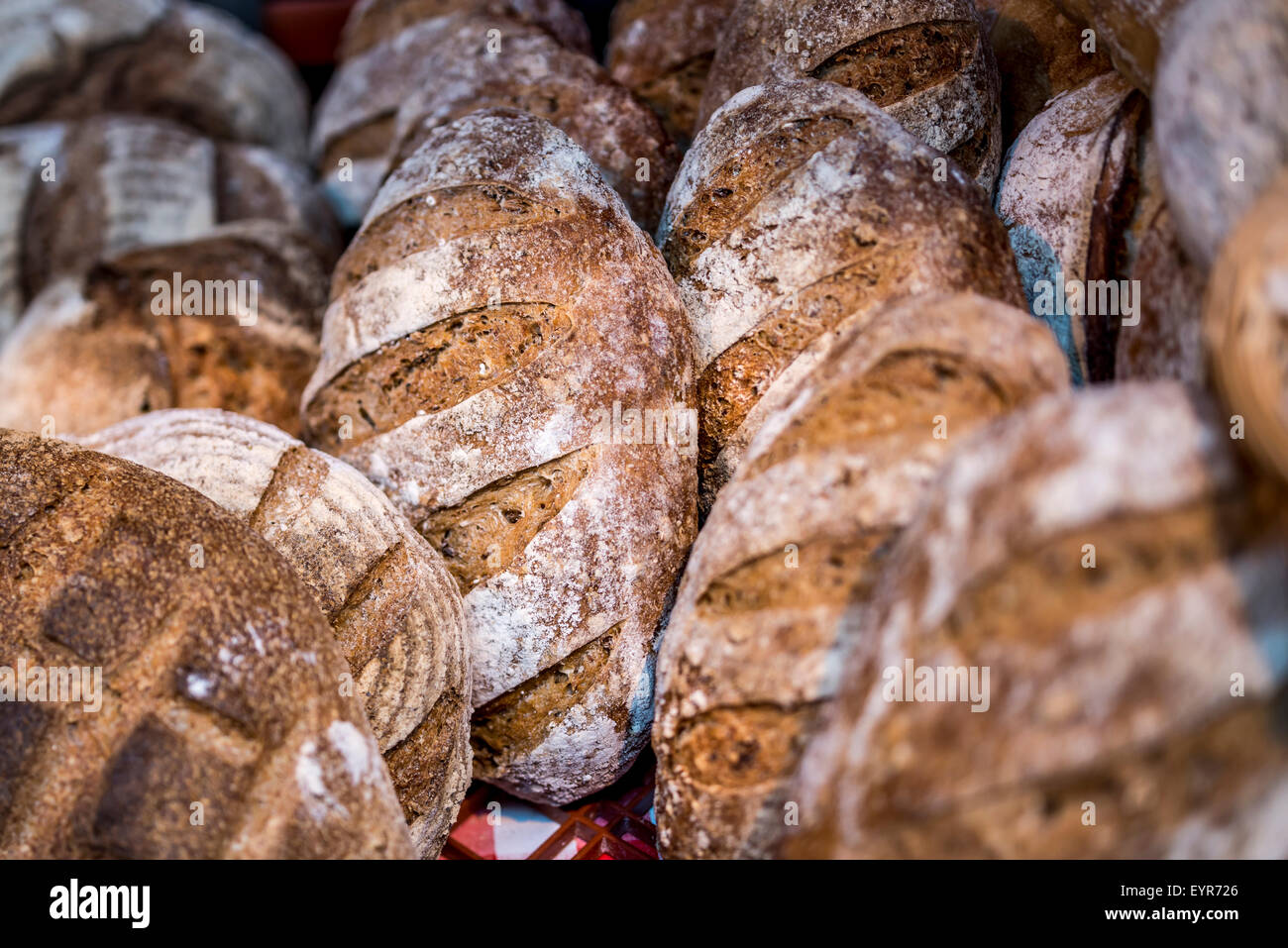 Various traditionally made sourdough breads in a bakery, Devon UK Stock