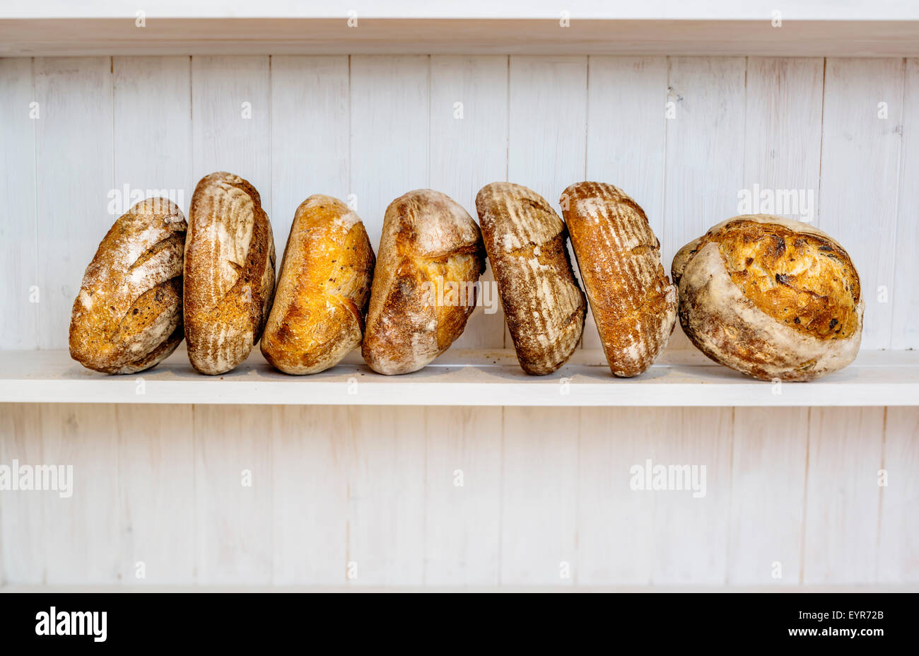 Various traditionally made sourdough breads in a bakery, Devon UK Stock