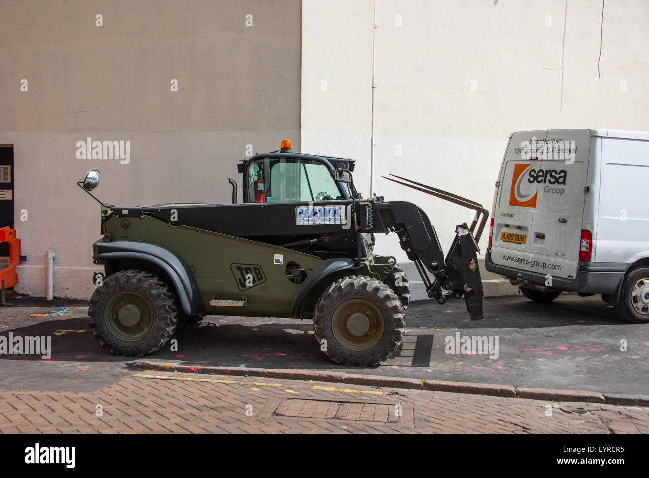 A JCB fork lift truck parked on street in Birmingham City Centre West Midlands UK Stock Photo