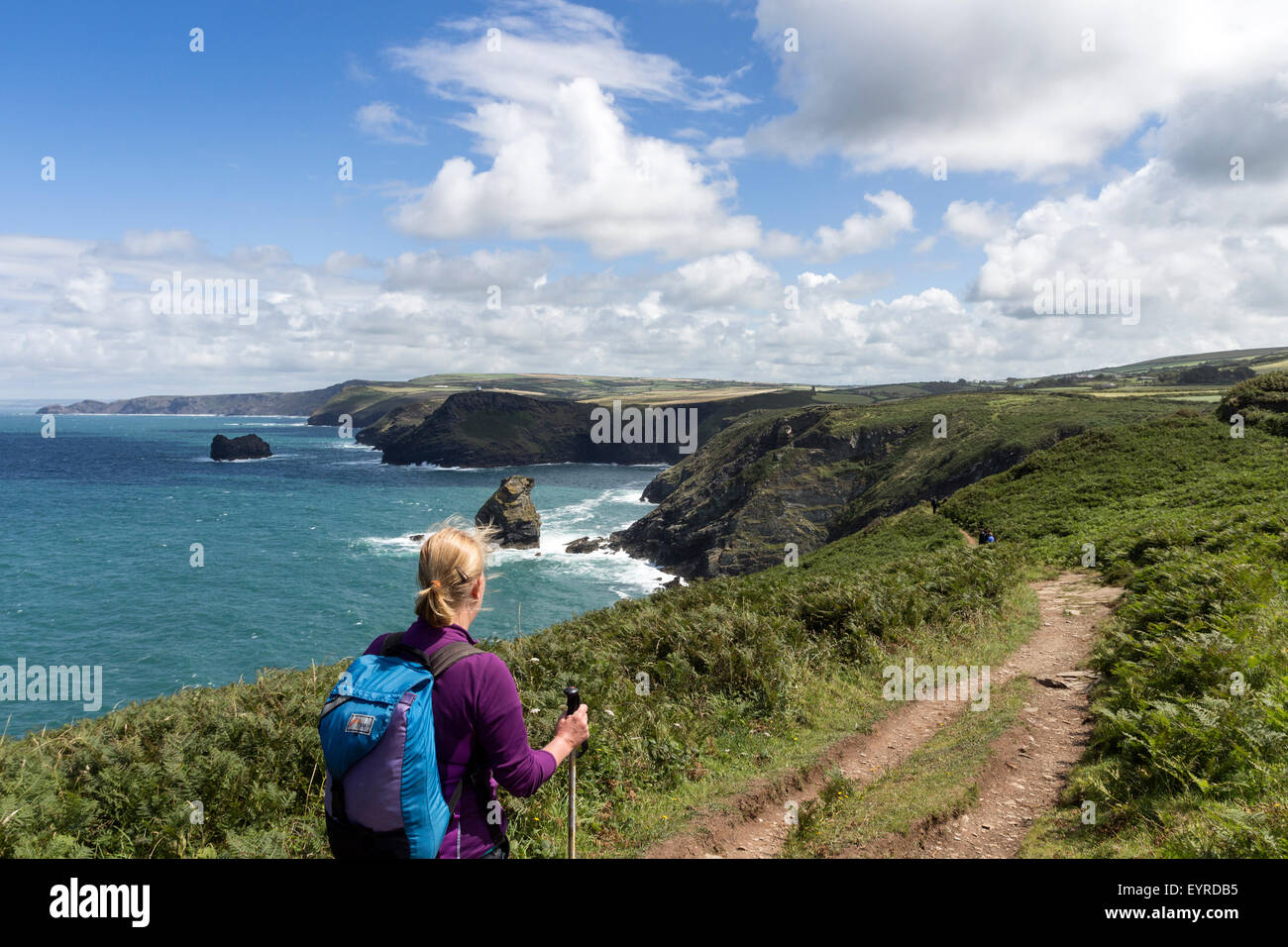 Walker on the South West Coast Path Between Tintagel and Boscastle Cornwall UK Stock Photo