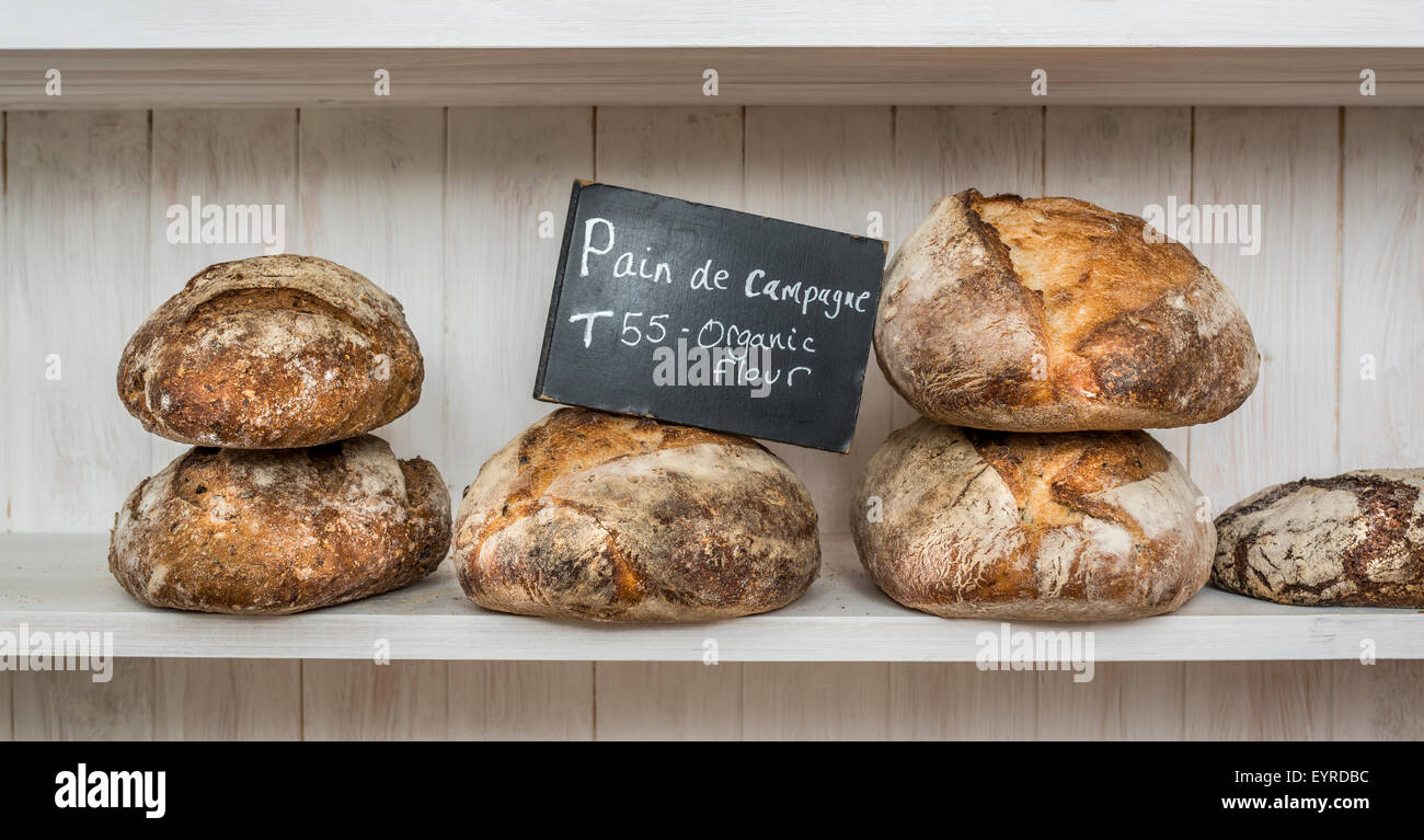 Various traditionally made sourdough breads in a bakery, Devon UK Stock