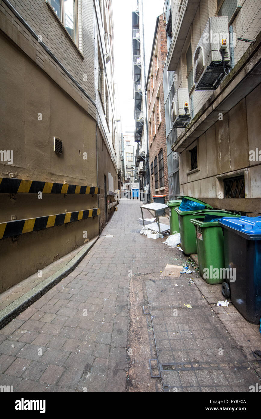 Fire Office Passage An alley way strewn with rubbish and litter in Birmingham city Centre West midlands UK Stock Photo