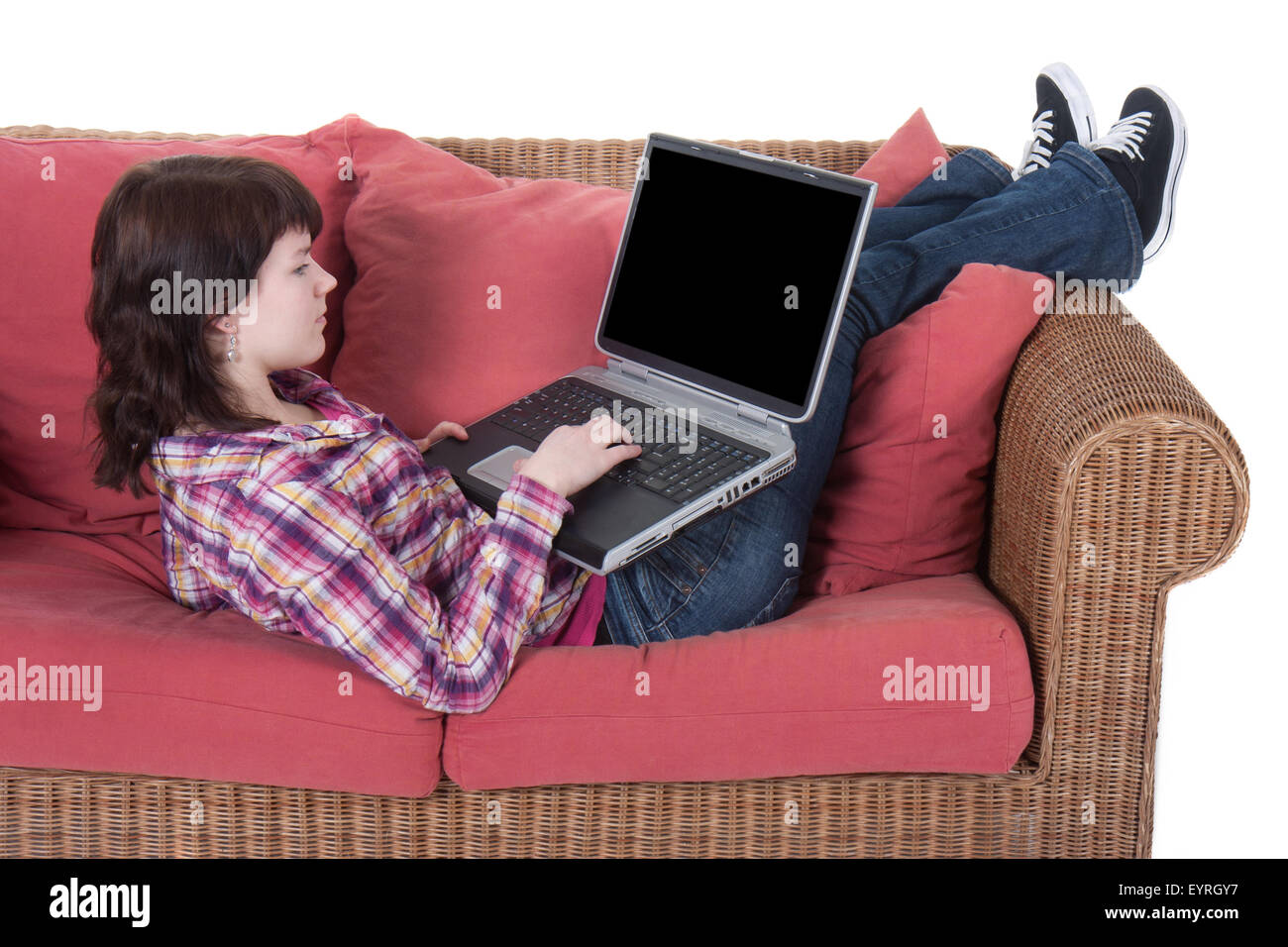Young girl working on her laptop isolated on white Stock Photo - Alamy