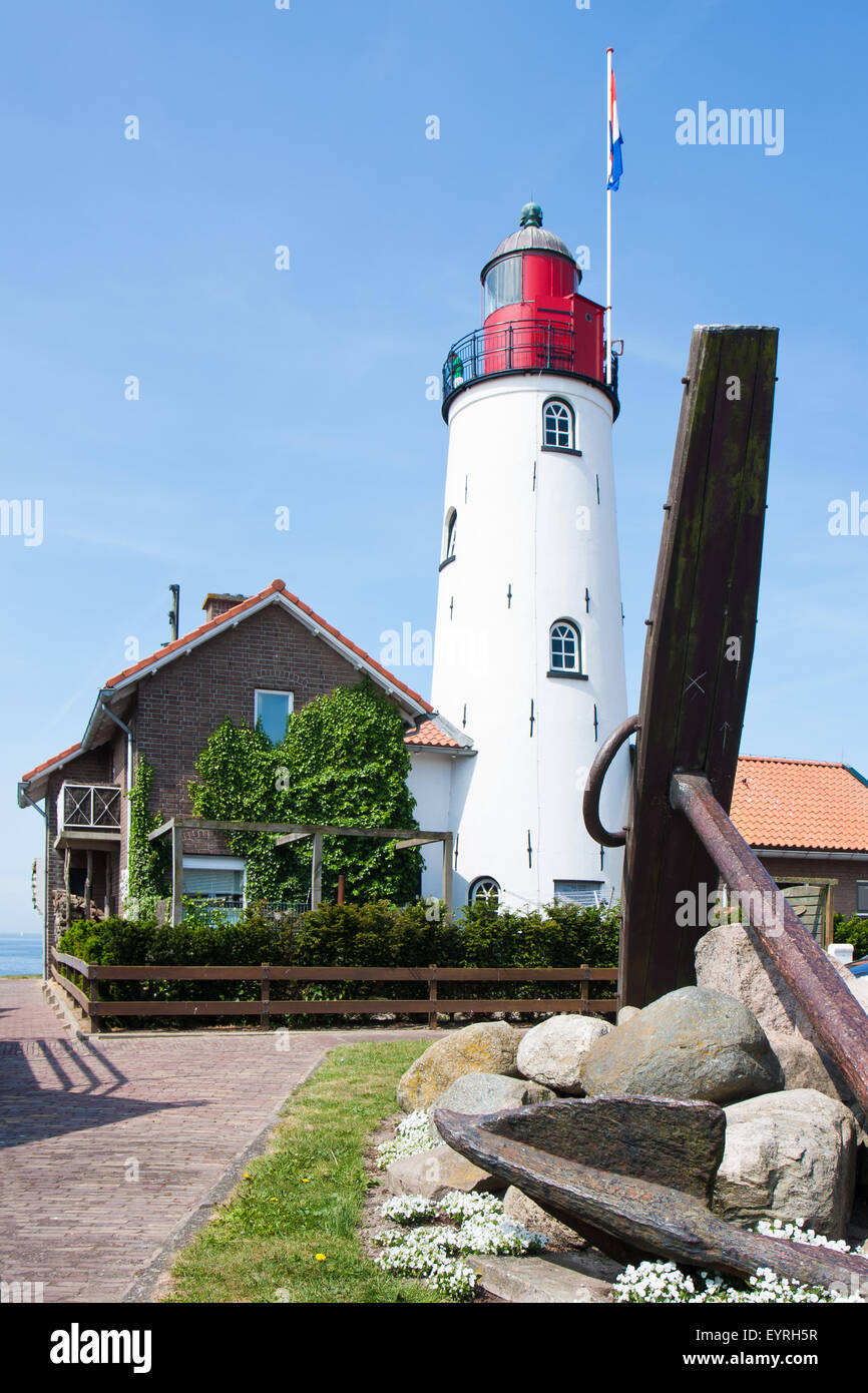 Dutch lighthouse with a big anchor in front of it Stock Photo - Alamy