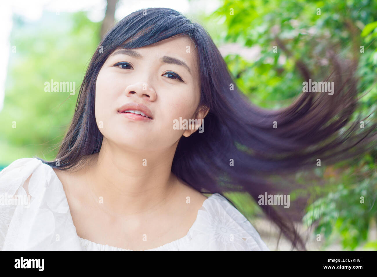 Portrait of young smiling Asian woman in park, Close up Stock Photo - Alamy