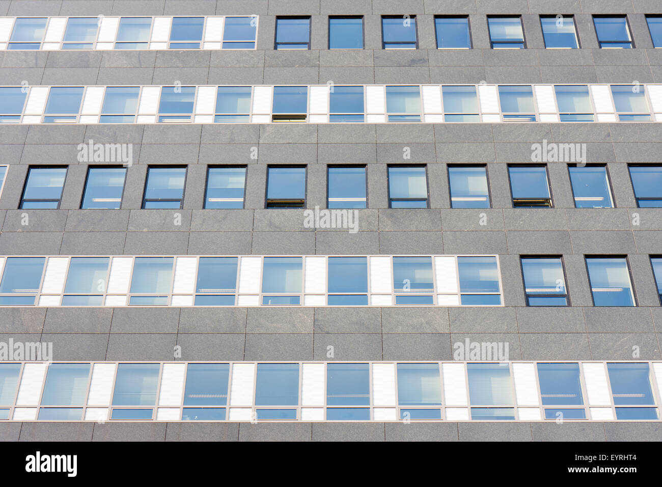Facade of a modern office building with symmetric glass windows Stock ...