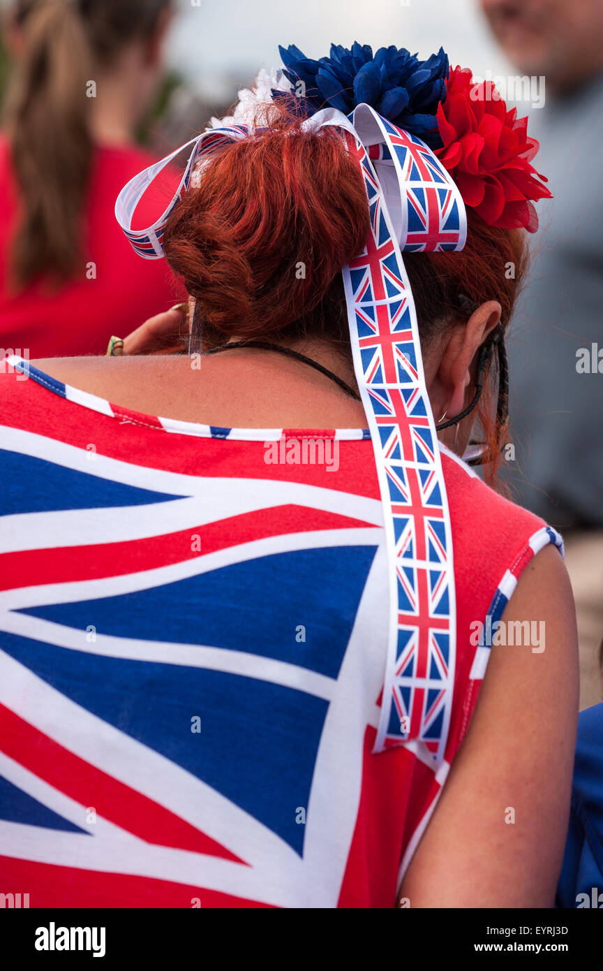 England. Woman with Union Jack flag bow in her hair and T shirt. Stock Photo